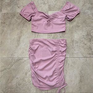 NWT Le Lis Collection pink ribbed crop top
and skirt coord set. Size small.